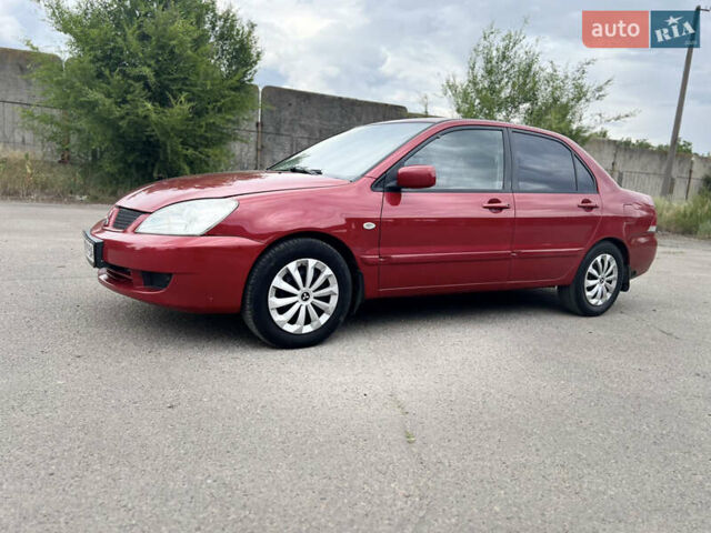 Червоний Міцубісі Lancer, об'ємом двигуна 1.6 л та пробігом 249 тис. км за 4250 $, фото 1 на Automoto.ua