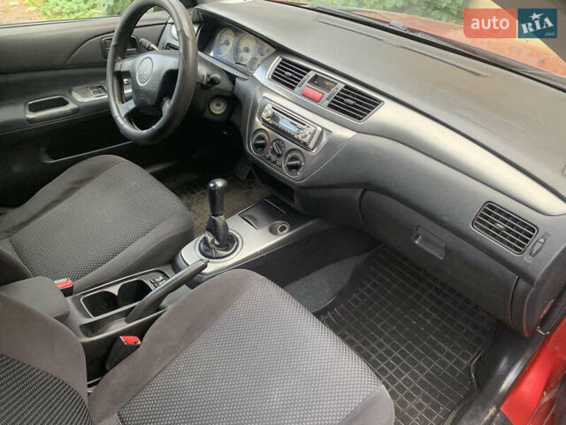 Червоний Міцубісі Lancer, об'ємом двигуна 1.6 л та пробігом 249 тис. км за 4250 $, фото 16 на Automoto.ua