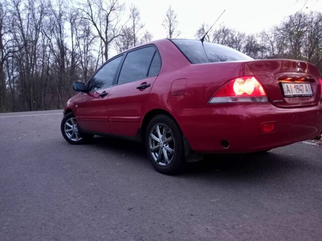 Красный Мицубиси Лансер, объемом двигателя 1.6 л и пробегом 450 тыс. км за 2850 $, фото 4 на Automoto.ua