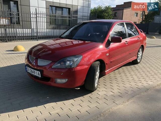 Червоний Міцубісі Lancer, об'ємом двигуна 2 л та пробігом 214 тис. км за 5400 $, фото 12 на Automoto.ua