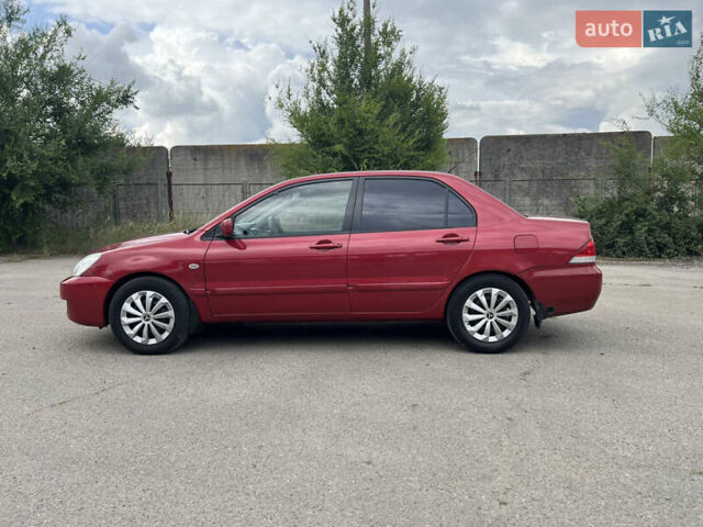 Червоний Міцубісі Lancer, об'ємом двигуна 1.6 л та пробігом 249 тис. км за 4250 $, фото 3 на Automoto.ua