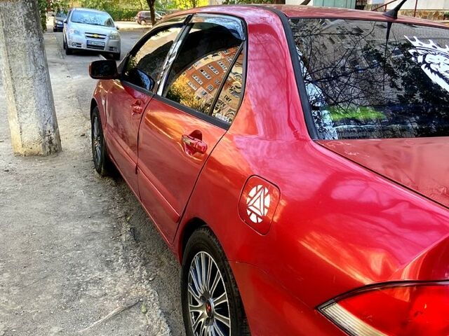 Червоний Міцубісі Lancer, об'ємом двигуна 1.6 л та пробігом 0 тис. км за 4500 $, фото 1 на Automoto.ua