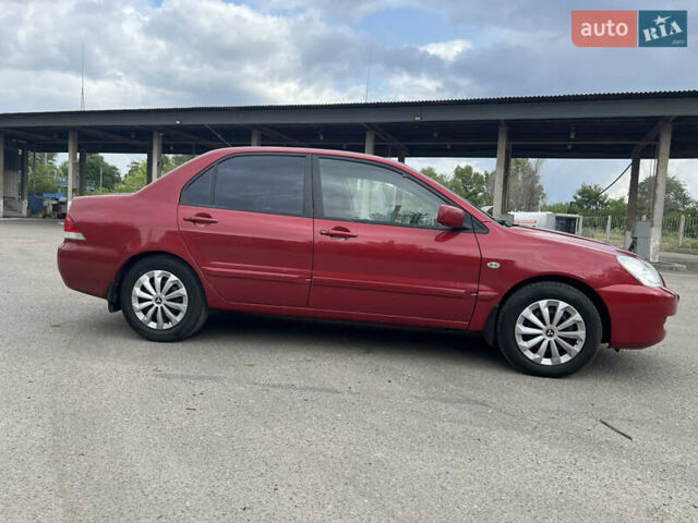 Червоний Міцубісі Lancer, об'ємом двигуна 1.6 л та пробігом 249 тис. км за 4250 $, фото 7 на Automoto.ua
