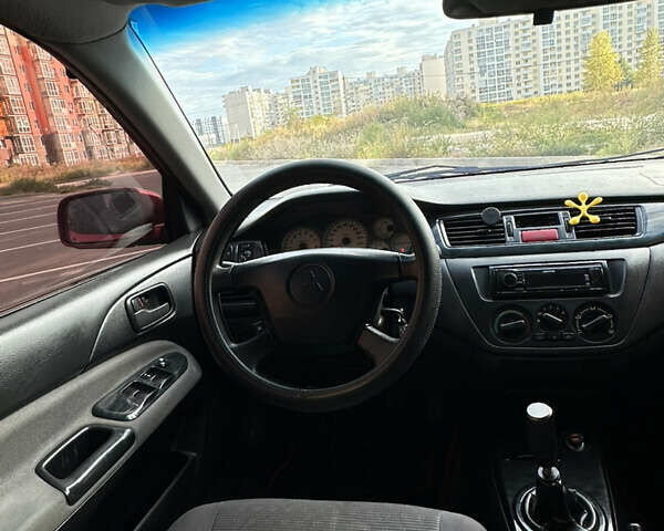 Красный Мицубиси Лансер, объемом двигателя 1.6 л и пробегом 331 тыс. км за 3700 $, фото 8 на Automoto.ua