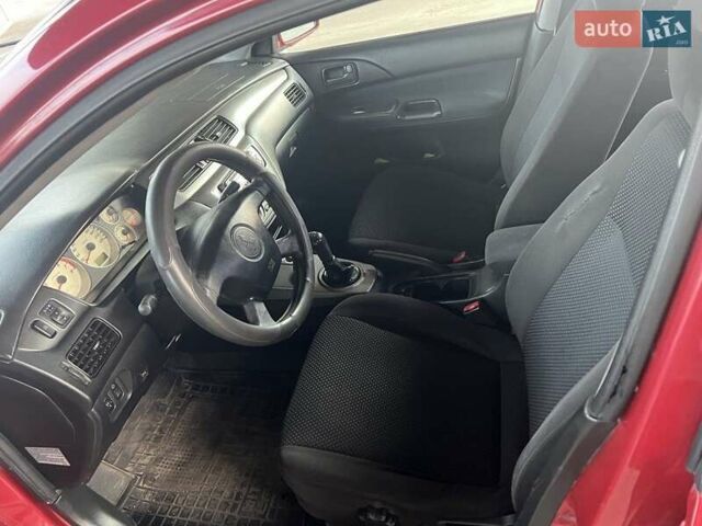 Красный Мицубиси Лансер, объемом двигателя 1.58 л и пробегом 250 тыс. км за 3999 $, фото 24 на Automoto.ua
