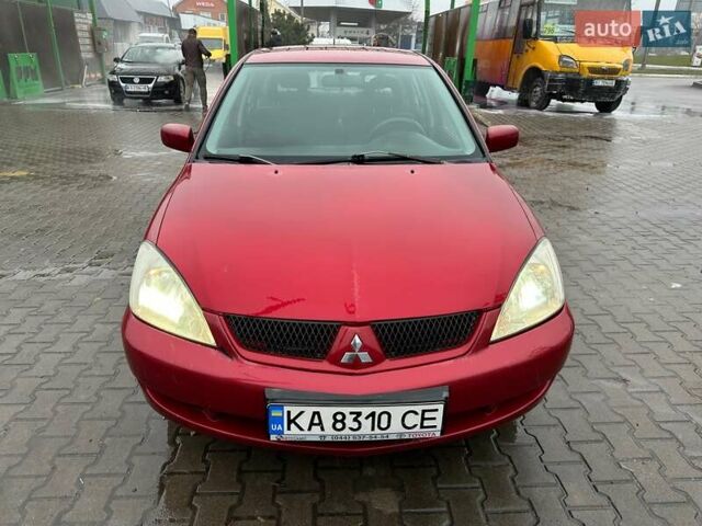 Красный Мицубиси Лансер, объемом двигателя 1.6 л и пробегом 185 тыс. км за 5000 $, фото 16 на Automoto.ua