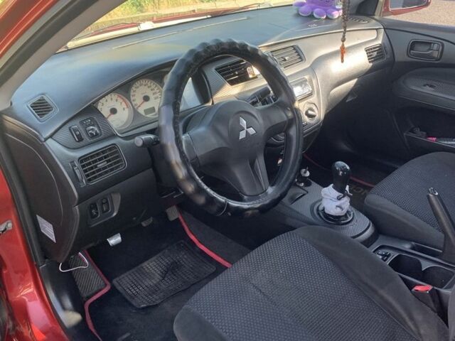 Червоний Міцубісі Lancer, об'ємом двигуна 1.6 л та пробігом 490 тис. км за 4000 $, фото 6 на Automoto.ua