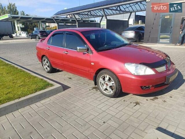 Красный Мицубиси Лансер, объемом двигателя 1.6 л и пробегом 73 тыс. км за 5500 $, фото 7 на Automoto.ua