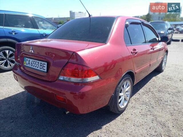 Червоний Міцубісі Lancer, об'ємом двигуна 1.6 л та пробігом 156 тис. км за 5200 $, фото 6 на Automoto.ua