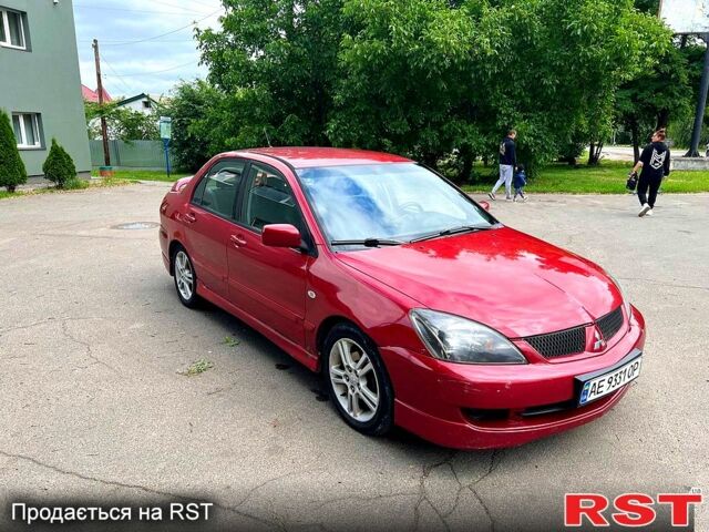 Красный Мицубиси Лансер, объемом двигателя 2 л и пробегом 223 тыс. км за 2900 $, фото 1 на Automoto.ua