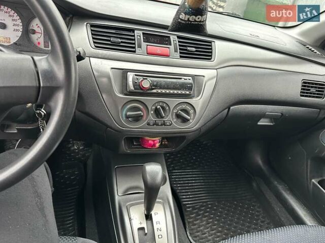 Красный Мицубиси Лансер, объемом двигателя 1.6 л и пробегом 185 тыс. км за 5000 $, фото 15 на Automoto.ua