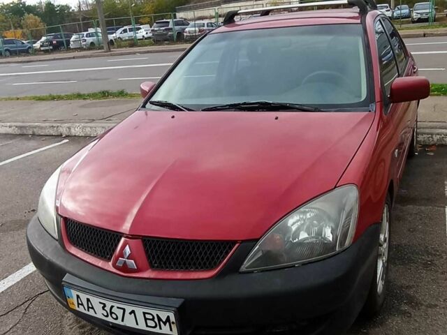 Красный Мицубиси Лансер, объемом двигателя 2 л и пробегом 320 тыс. км за 4600 $, фото 2 на Automoto.ua