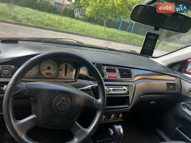 Красный Мицубиси Лансер, объемом двигателя 1.6 л и пробегом 312 тыс. км за 4600 $, фото 8 на Automoto.ua