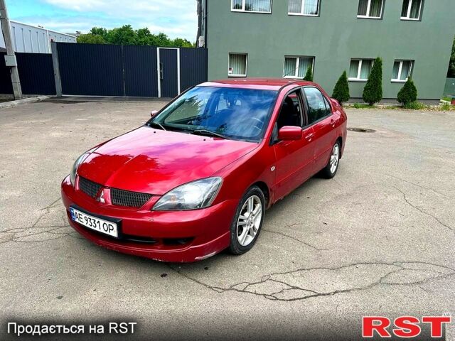 Красный Мицубиси Лансер, объемом двигателя 2 л и пробегом 223 тыс. км за 2900 $, фото 2 на Automoto.ua