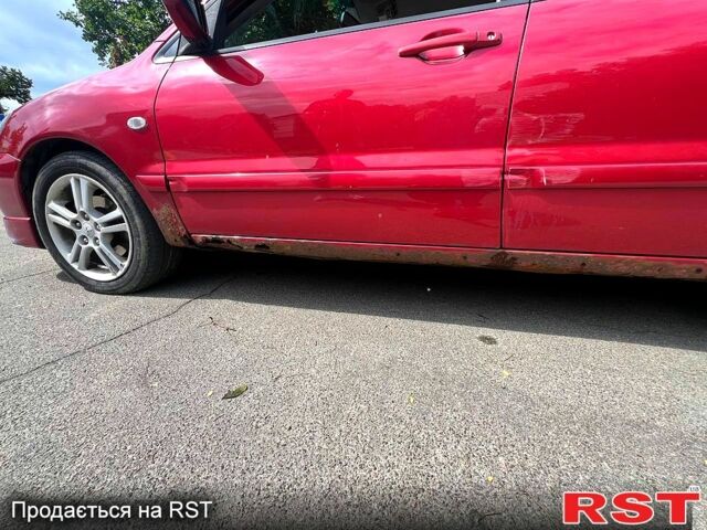 Красный Мицубиси Лансер, объемом двигателя 2 л и пробегом 223 тыс. км за 2900 $, фото 8 на Automoto.ua