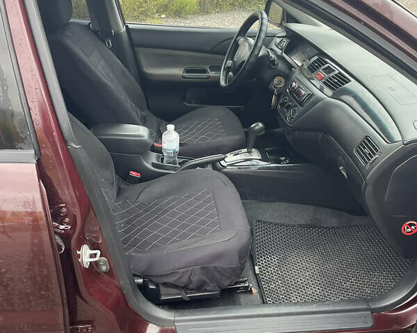 Червоний Міцубісі Lancer, об'ємом двигуна 2 л та пробігом 295 тис. км за 4150 $, фото 11 на Automoto.ua