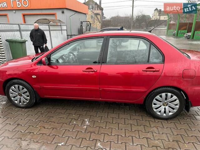 Красный Мицубиси Лансер, объемом двигателя 1.6 л и пробегом 185 тыс. км за 5000 $, фото 1 на Automoto.ua