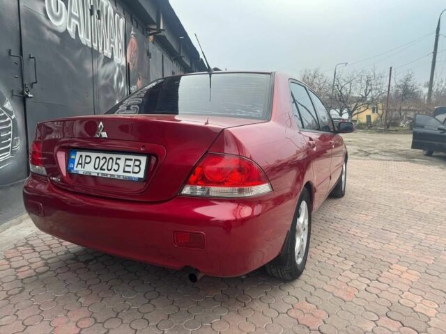 Красный Мицубиси Лансер, объемом двигателя 1.6 л и пробегом 276 тыс. км за 4350 $, фото 4 на Automoto.ua