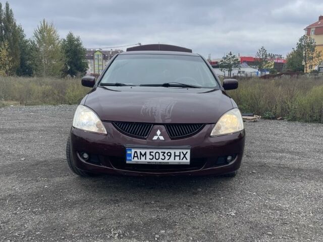 Красный Мицубиси Лансер, объемом двигателя 2 л и пробегом 295 тыс. км за 4150 $, фото 1 на Automoto.ua