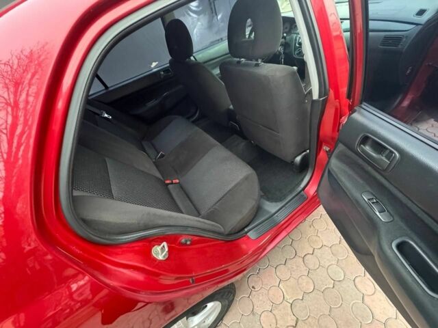 Красный Мицубиси Лансер, объемом двигателя 1.6 л и пробегом 276 тыс. км за 4350 $, фото 11 на Automoto.ua