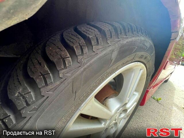 Красный Мицубиси Лансер, объемом двигателя 2 л и пробегом 223 тыс. км за 2900 $, фото 7 на Automoto.ua