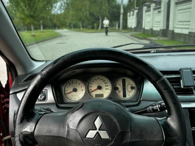 Червоний Міцубісі Lancer, об'ємом двигуна 1.6 л та пробігом 270 тис. км за 2200 $, фото 7 на Automoto.ua