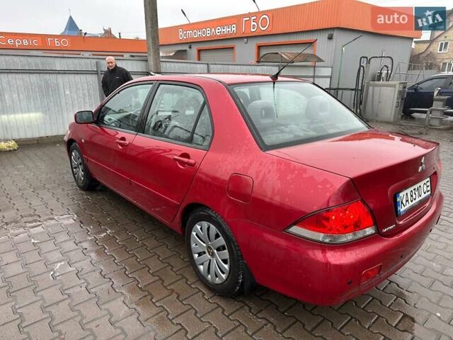 Красный Мицубиси Лансер, объемом двигателя 1.6 л и пробегом 185 тыс. км за 5000 $, фото 2 на Automoto.ua