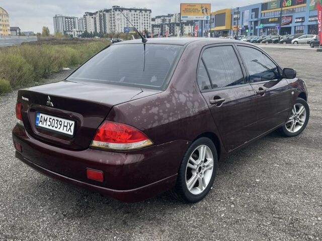 Красный Мицубиси Лансер, объемом двигателя 2 л и пробегом 295 тыс. км за 4150 $, фото 4 на Automoto.ua