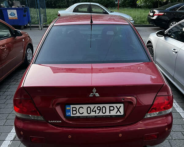 Красный Мицубиси Лансер, объемом двигателя 1.6 л и пробегом 312 тыс. км за 4600 $, фото 2 на Automoto.ua