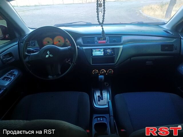 Мицубиси Лансер 2006 в Николаеве на Automoto.ua Красный Мицубиси Лансер, объемом двигателя 1.6 л и пробегом 260 тыс. км за 4600 $, фото 8 на Automoto.ua