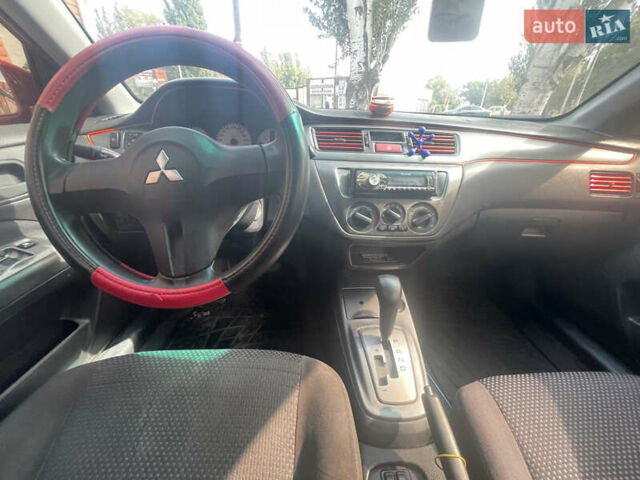 Червоний Міцубісі Lancer, об'ємом двигуна 1.58 л та пробігом 290 тис. км за 4250 $, фото 16 на Automoto.ua