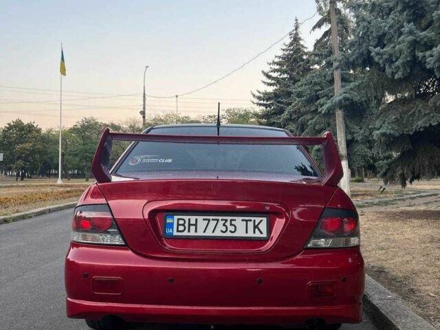 Красный Мицубиси Лансер, объемом двигателя 2 л и пробегом 307 тыс. км за 4500 $, фото 7 на Automoto.ua