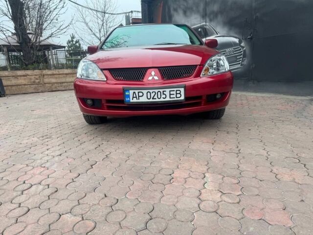 Красный Мицубиси Лансер, объемом двигателя 1.6 л и пробегом 276 тыс. км за 4350 $, фото 1 на Automoto.ua