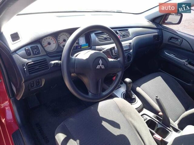 Червоний Міцубісі Lancer, об'ємом двигуна 1.6 л та пробігом 156 тис. км за 5200 $, фото 28 на Automoto.ua