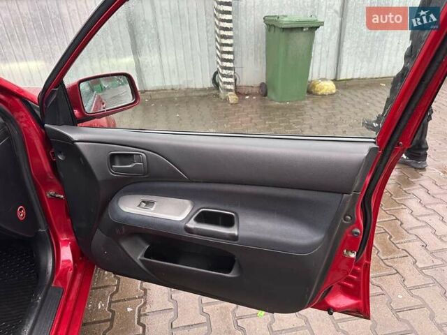 Красный Мицубиси Лансер, объемом двигателя 1.6 л и пробегом 185 тыс. км за 5000 $, фото 7 на Automoto.ua