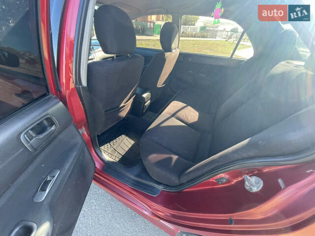 Червоний Міцубісі Lancer, об'ємом двигуна 1.58 л та пробігом 290 тис. км за 4350 $, фото 12 на Automoto.ua