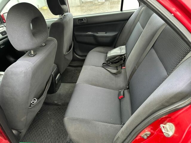 Червоний Міцубісі Lancer, об'ємом двигуна 1.6 л та пробігом 185 тис. км за 5000 $, фото 12 на Automoto.ua