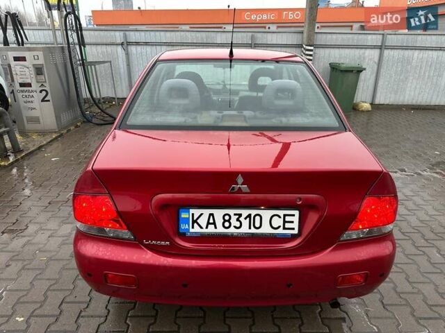 Красный Мицубиси Лансер, объемом двигателя 1.6 л и пробегом 185 тыс. км за 5000 $, фото 3 на Automoto.ua