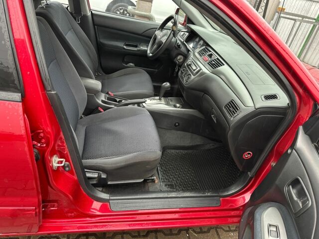Червоний Міцубісі Lancer, об'ємом двигуна 1.6 л та пробігом 185 тис. км за 5000 $, фото 7 на Automoto.ua