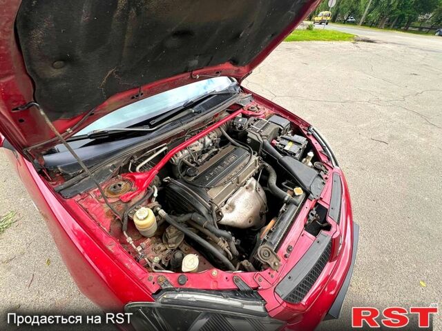 Красный Мицубиси Лансер, объемом двигателя 2 л и пробегом 223 тыс. км за 2900 $, фото 6 на Automoto.ua