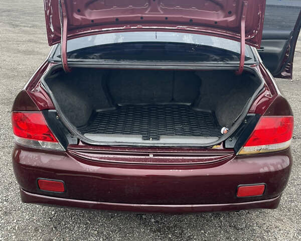 Червоний Міцубісі Lancer, об'ємом двигуна 2 л та пробігом 295 тис. км за 4150 $, фото 7 на Automoto.ua