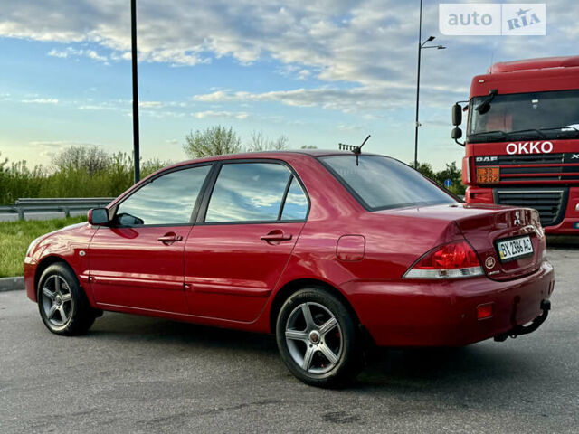 Червоний Міцубісі Lancer, об'ємом двигуна 1.6 л та пробігом 143 тис. км за 6300 $, фото 3 на Automoto.ua