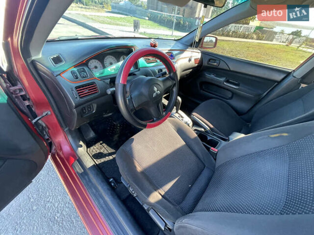 Червоний Міцубісі Lancer, об'ємом двигуна 1.58 л та пробігом 290 тис. км за 4350 $, фото 9 на Automoto.ua