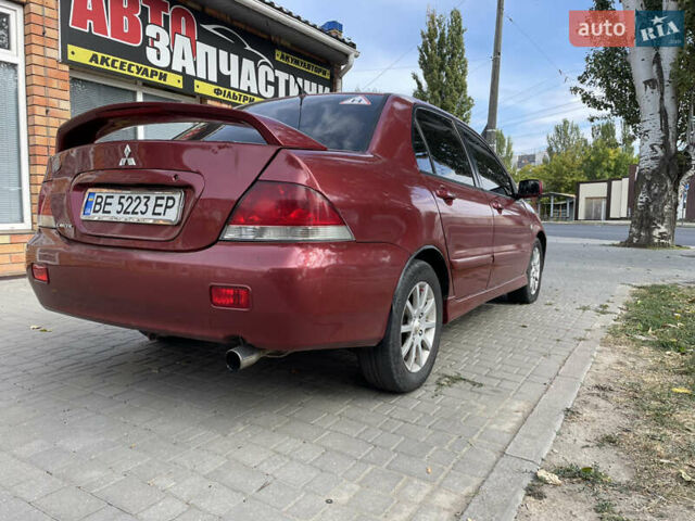 Червоний Міцубісі Lancer, об'ємом двигуна 1.58 л та пробігом 290 тис. км за 4250 $, фото 6 на Automoto.ua
