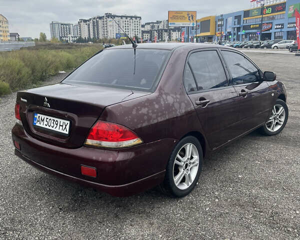 Червоний Міцубісі Lancer, об'ємом двигуна 2 л та пробігом 295 тис. км за 4150 $, фото 4 на Automoto.ua