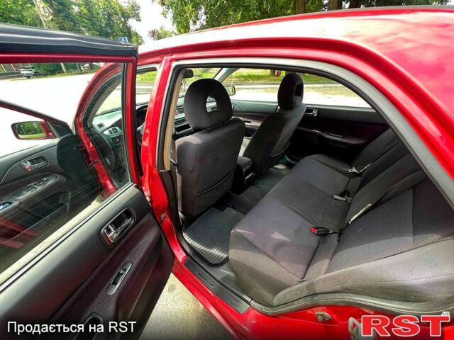 Красный Мицубиси Лансер, объемом двигателя 2 л и пробегом 223 тыс. км за 2900 $, фото 9 на Automoto.ua