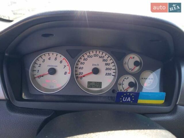 Червоний Міцубісі Lancer, об'ємом двигуна 1.6 л та пробігом 156 тис. км за 5200 $, фото 29 на Automoto.ua