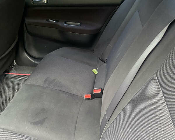 Міцубісі Lancer 2006 у Вышгороде на Automoto.ua Червоний Міцубісі Lancer, об'ємом двигуна 2 л та пробігом 320 тис. км за 2500 $, фото 6 на Automoto.ua