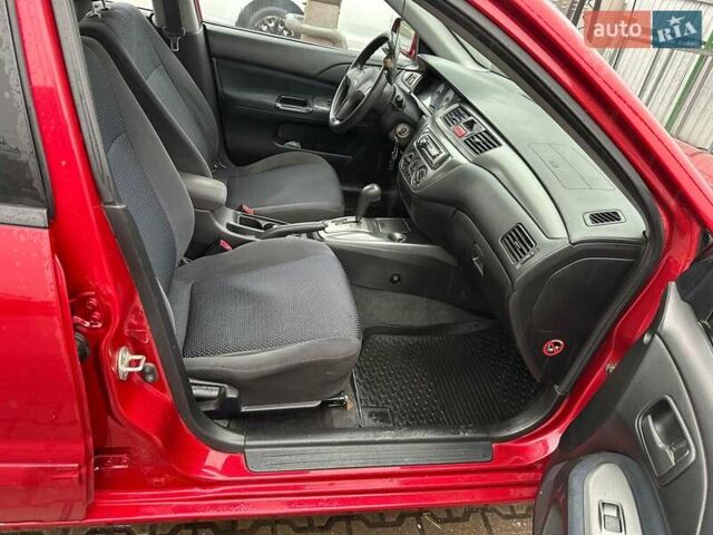Красный Мицубиси Лансер, объемом двигателя 1.6 л и пробегом 185 тыс. км за 5000 $, фото 6 на Automoto.ua