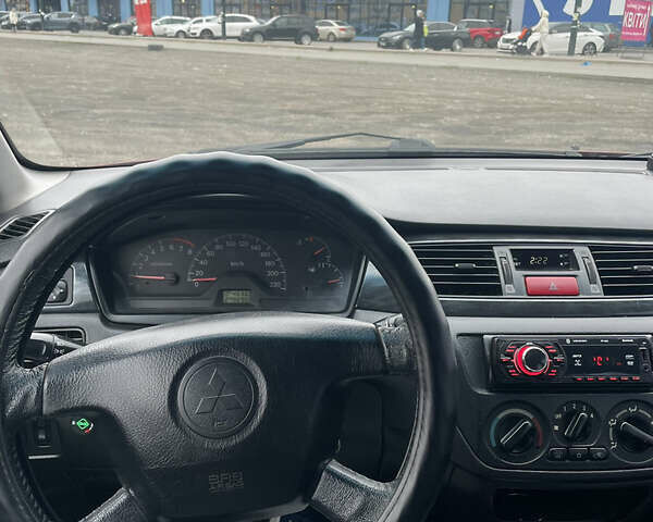 Червоний Міцубісі Lancer, об'ємом двигуна 2 л та пробігом 295 тис. км за 4150 $, фото 9 на Automoto.ua